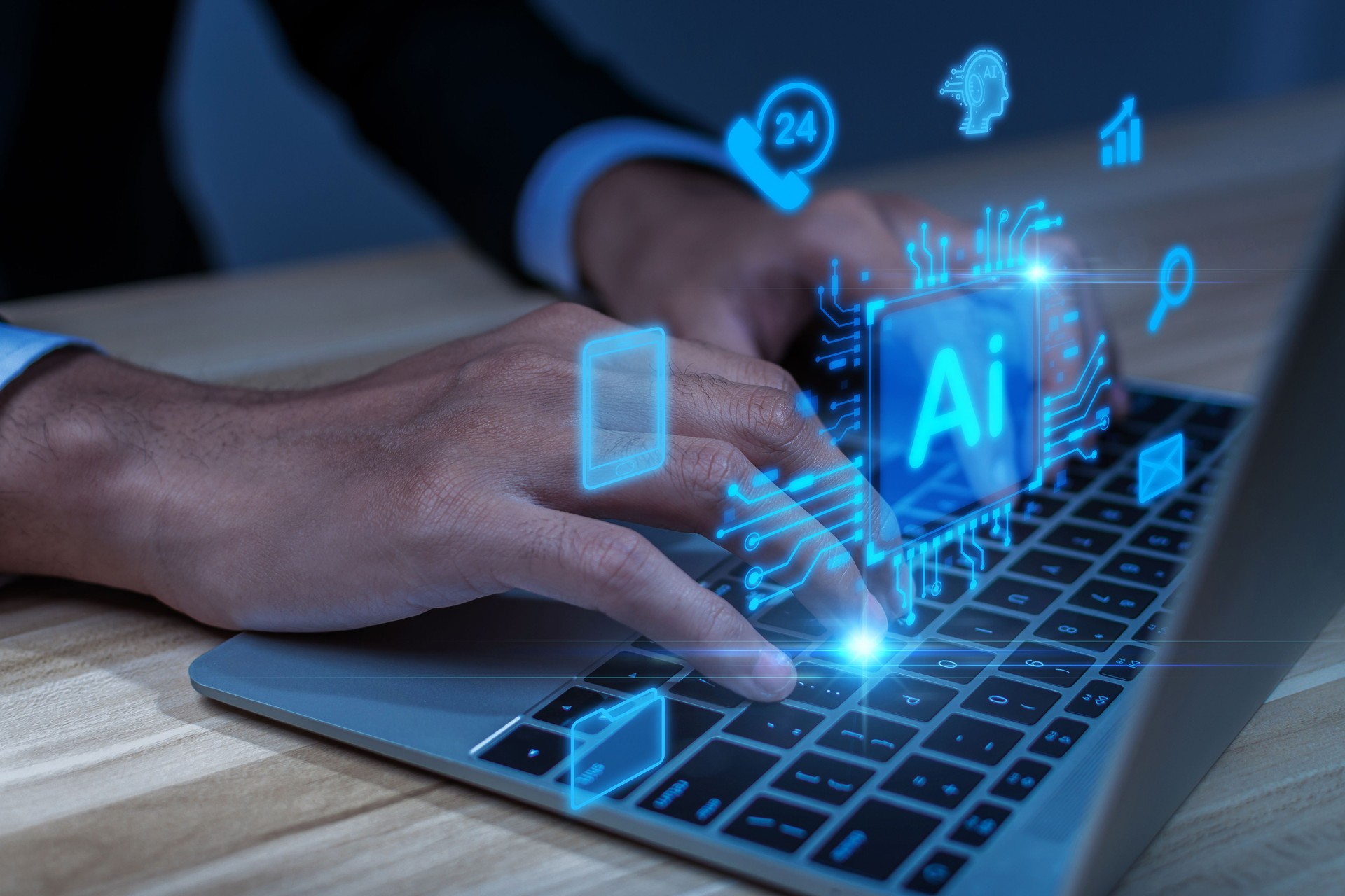 hand typing on laptop computer with holographic AI technology icons overlay. Concept of artificial intelligence, machine learning, data analysis, digital innovation, and future technology trends